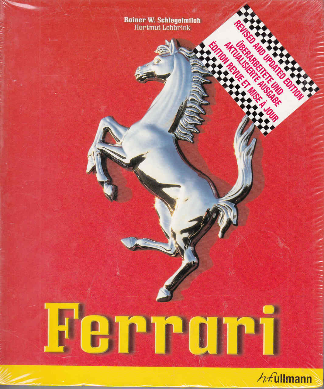 Ferrari book cover with prancing silver horse emblem and yellow lettering