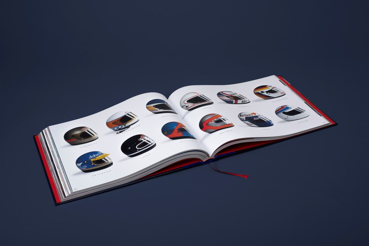 Opened helmet-themed book spread with multiple small helmet photos arranged in a grid.