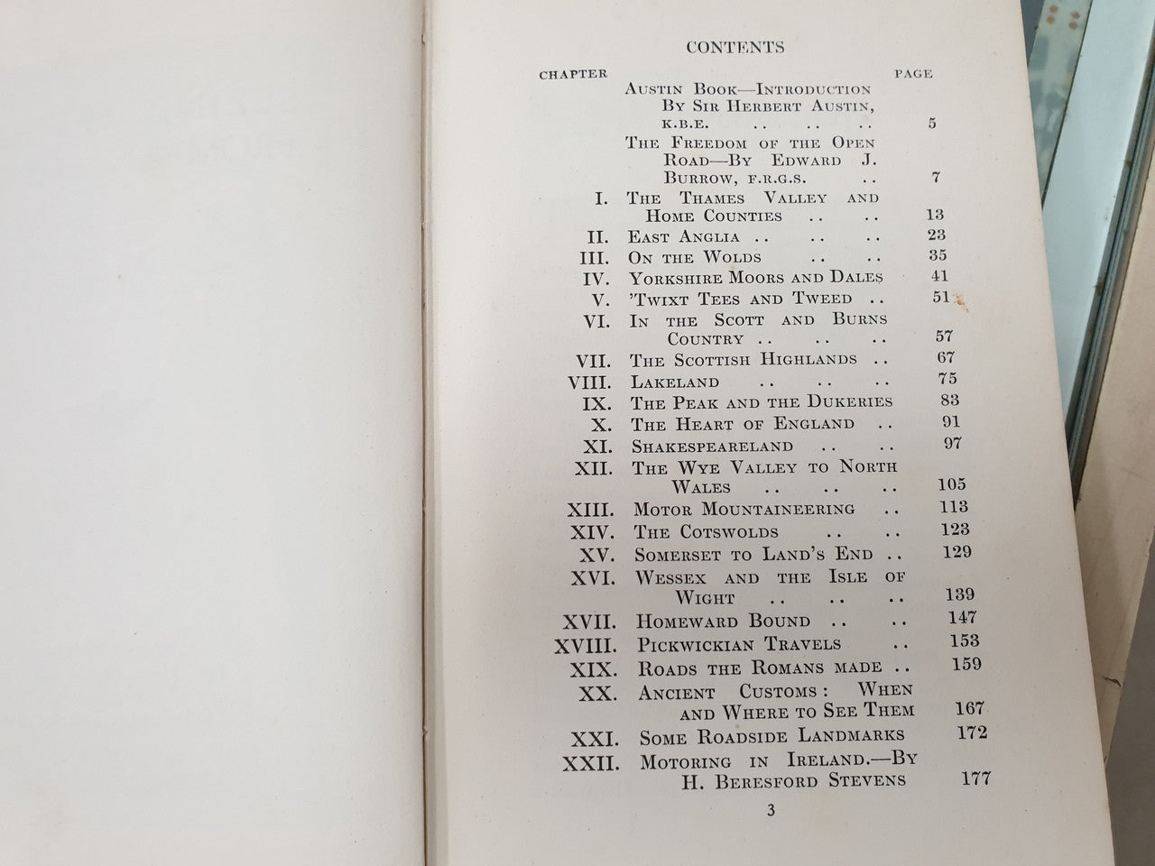 Book open to contents page with chapter list in black text on cream paper