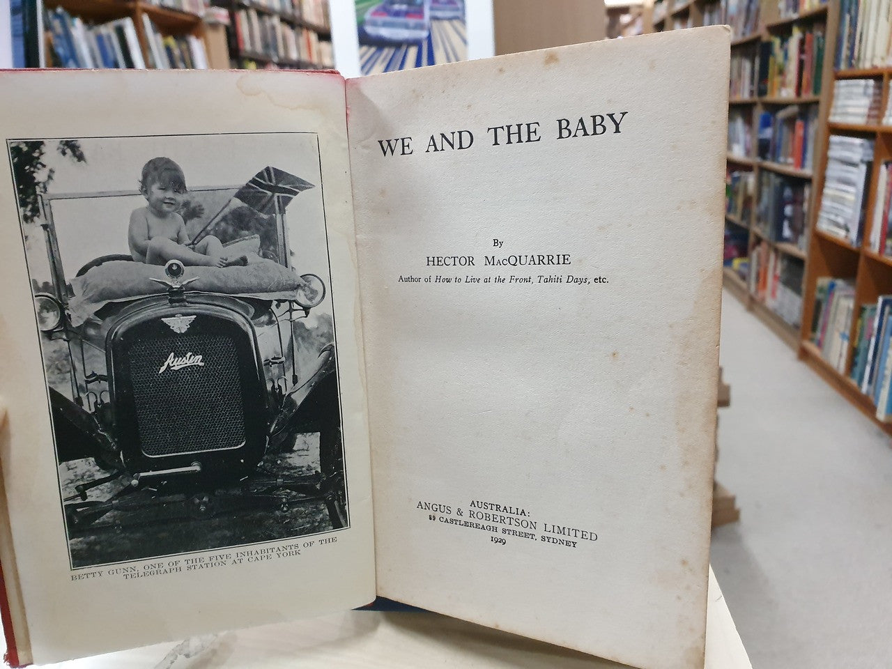 Open book with black-and-white photo insert and printed title page, Hector MacQuarrie