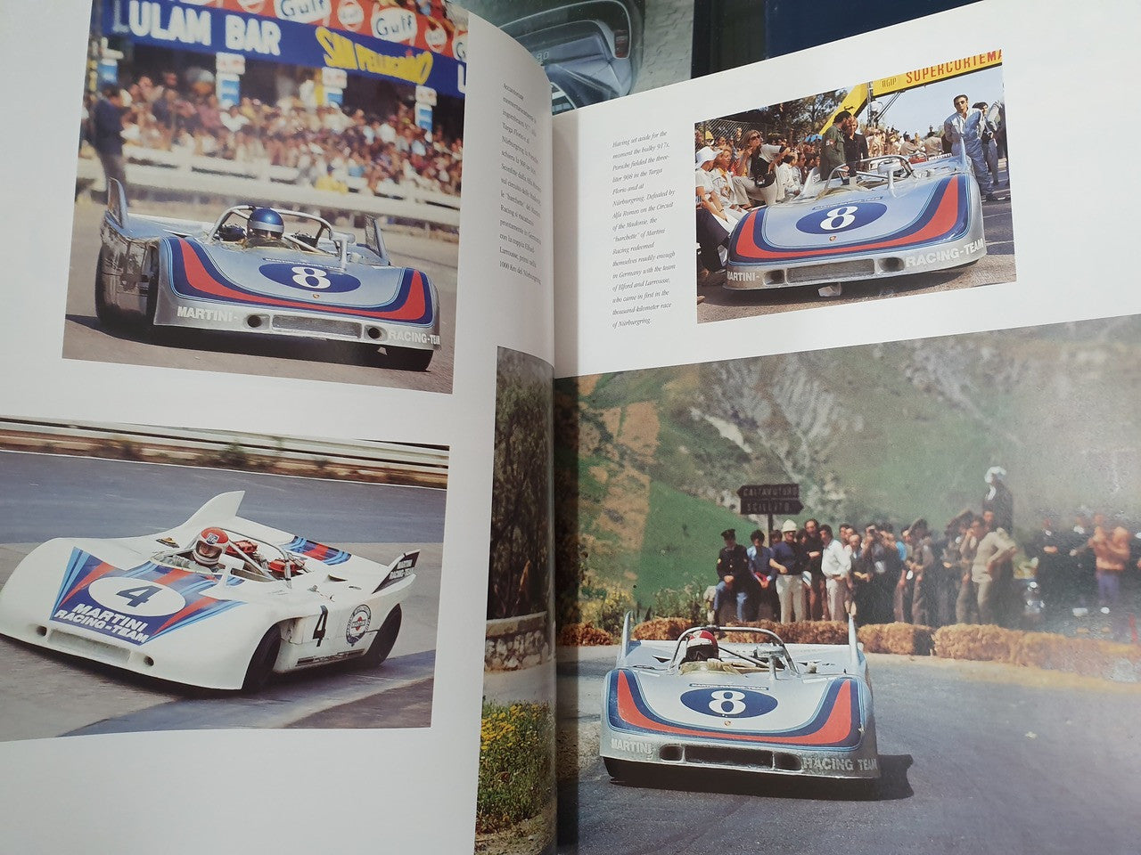Hardcover racing story book open, racing car photos across two pages