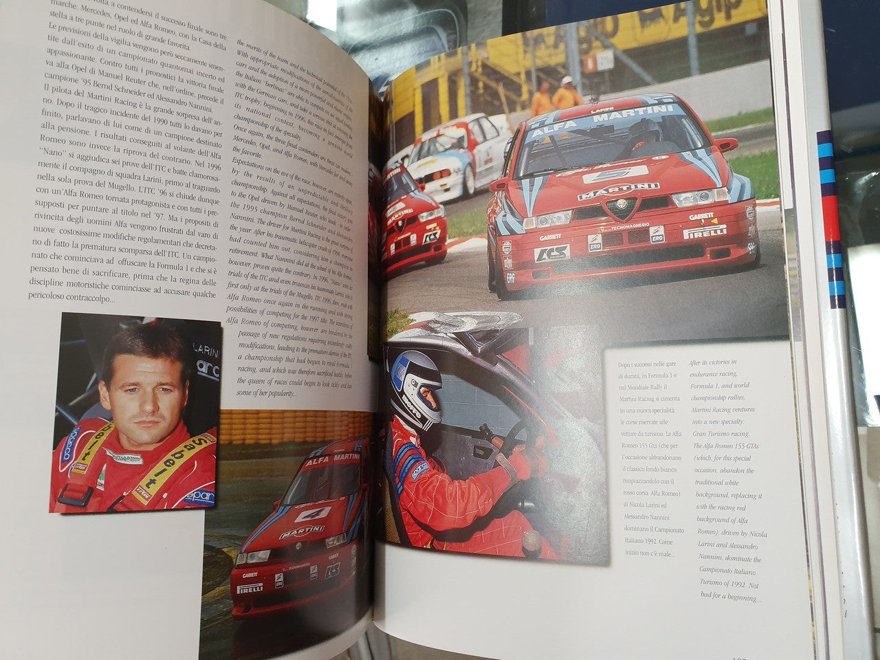 Hardcover racing story book open, race car close-up and driver portrait