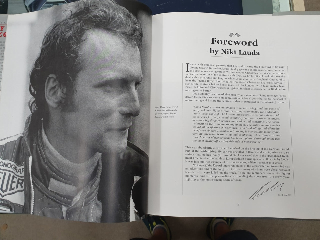 Hardcover book open to a foreword page with a black-and-white portrait