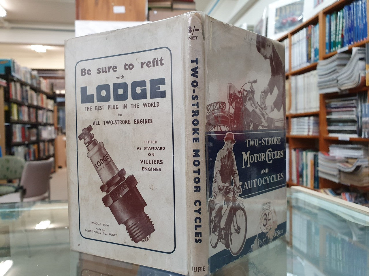 Hardcover book with side cover showing an engine diagram and title text