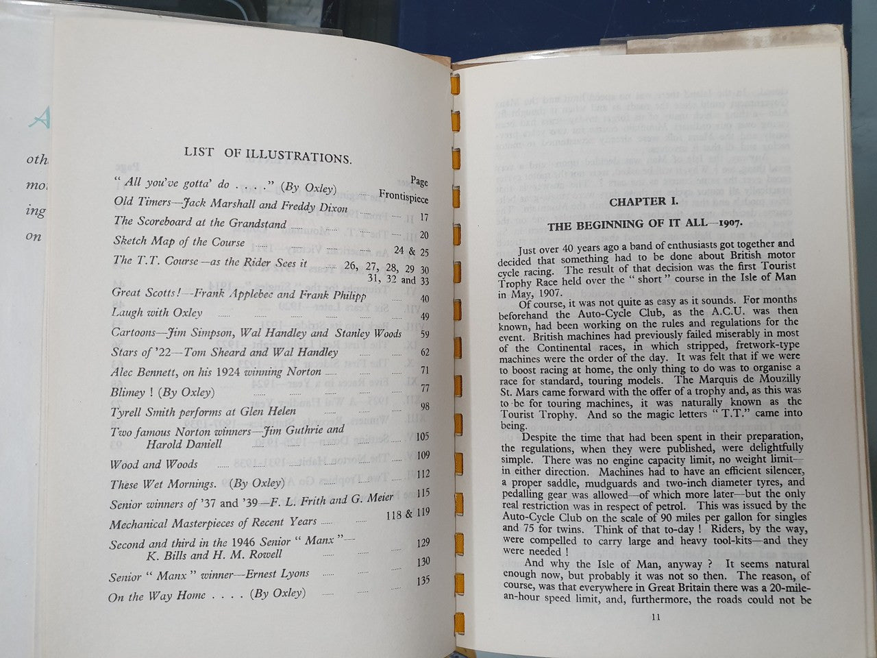 Open hardcover book with “LIST OF ILLUSTRATIONS” heading and chapter text.