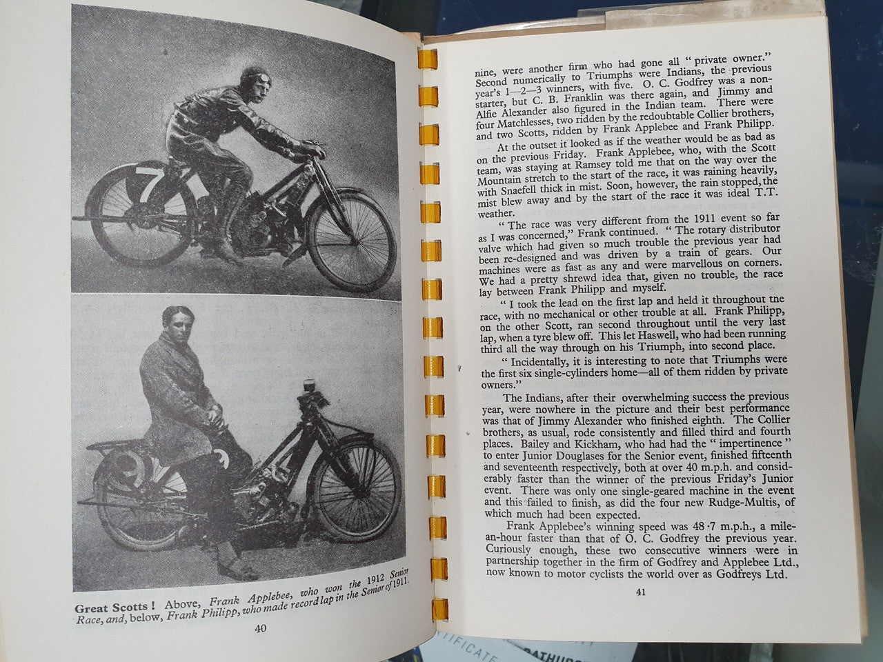Open hardcover book with two motorbike photos on left and chapter text on right.