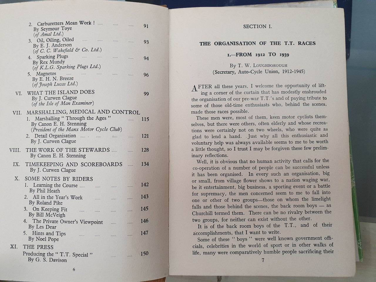 Open book pages with heading "THE ORGANISATION OF THE T.T. RACES" and section text
