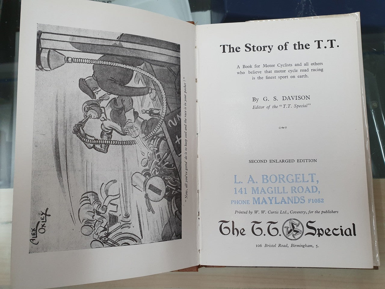 Open book spread with motorcycle illustration and title text