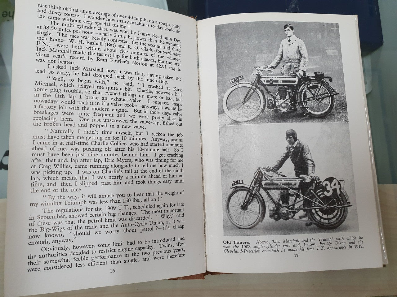 Open book spread with paragraph text and black-and-white motorcycle race photos