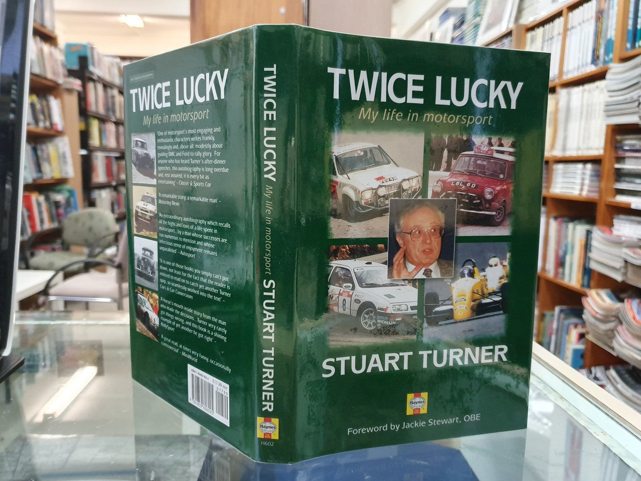 Hardcover autobiography book on display, green cover and spine with title