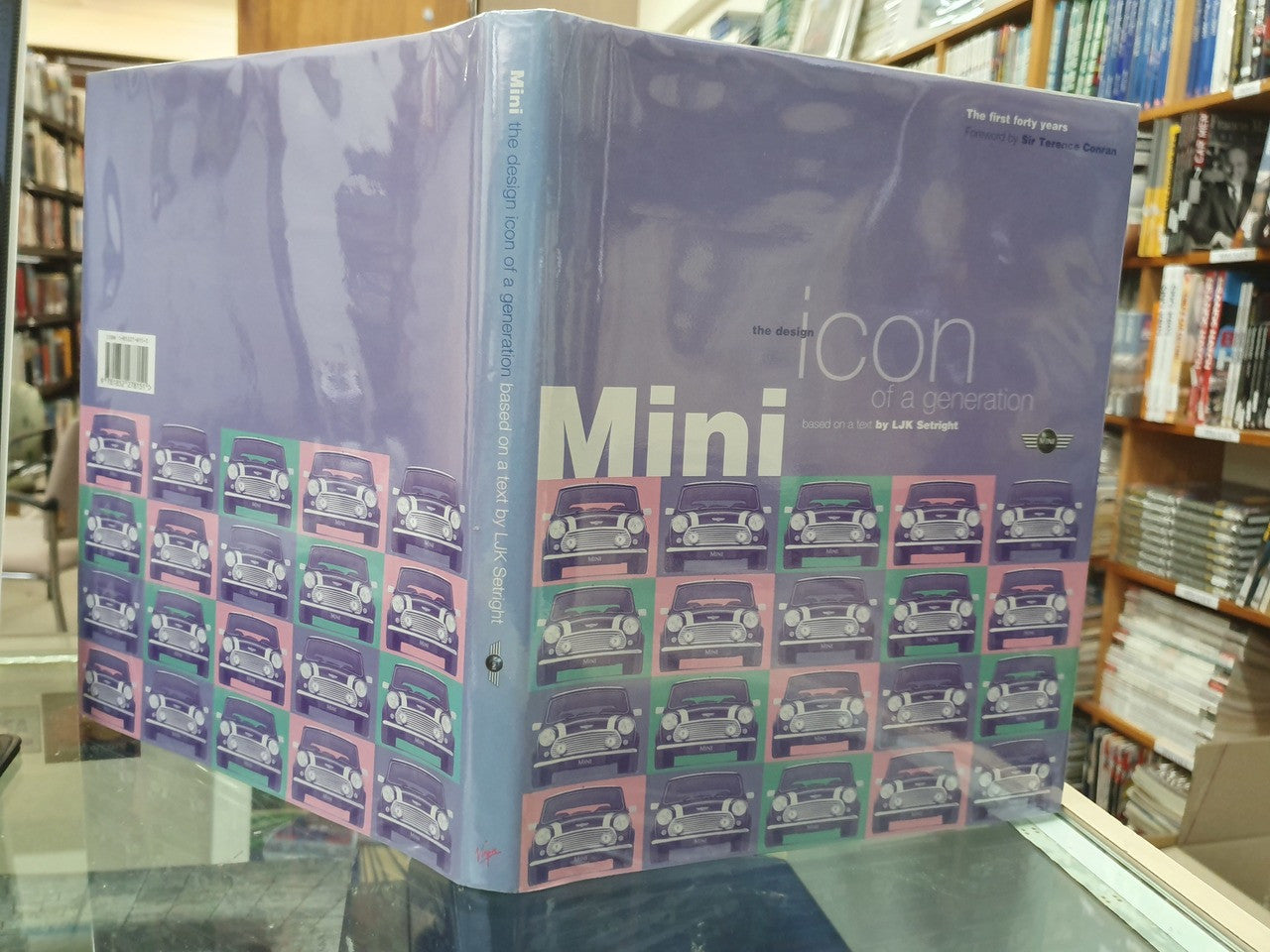 Hardcover book with blue Mini collage cover and 'iCon Mini' title