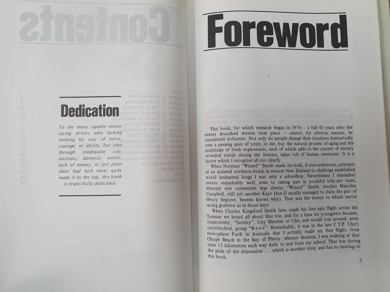 Hardcover book open to "Foreword" and "Dedication" pages with text blocks