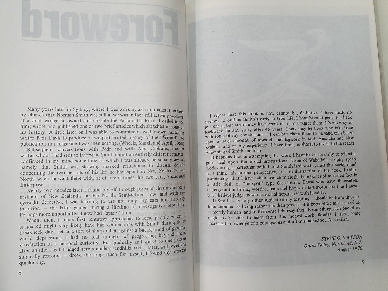 Hardcover book open to two pages of printed narrative text