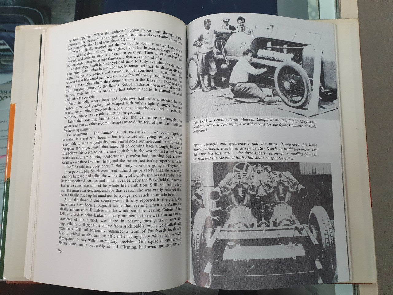 Hardcover book open to two printed pages with black-and-white photos