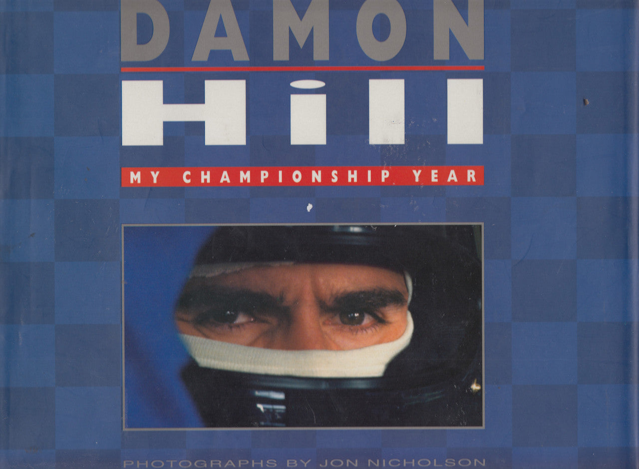 Hardbound racing book cover with Damon Hill title and portrait in helmet