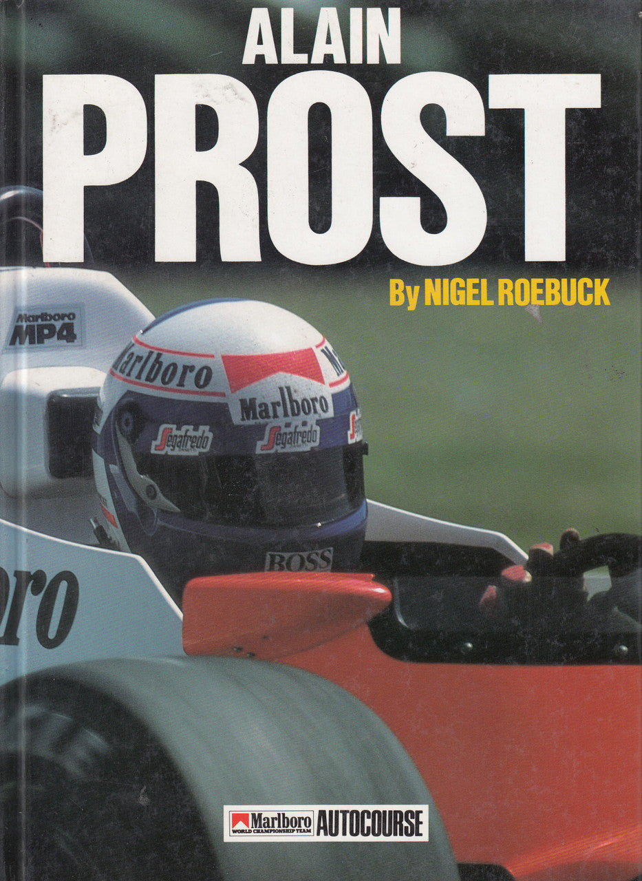 Hardcover racing biography book with Alain Prost cover art and Formula car helmet