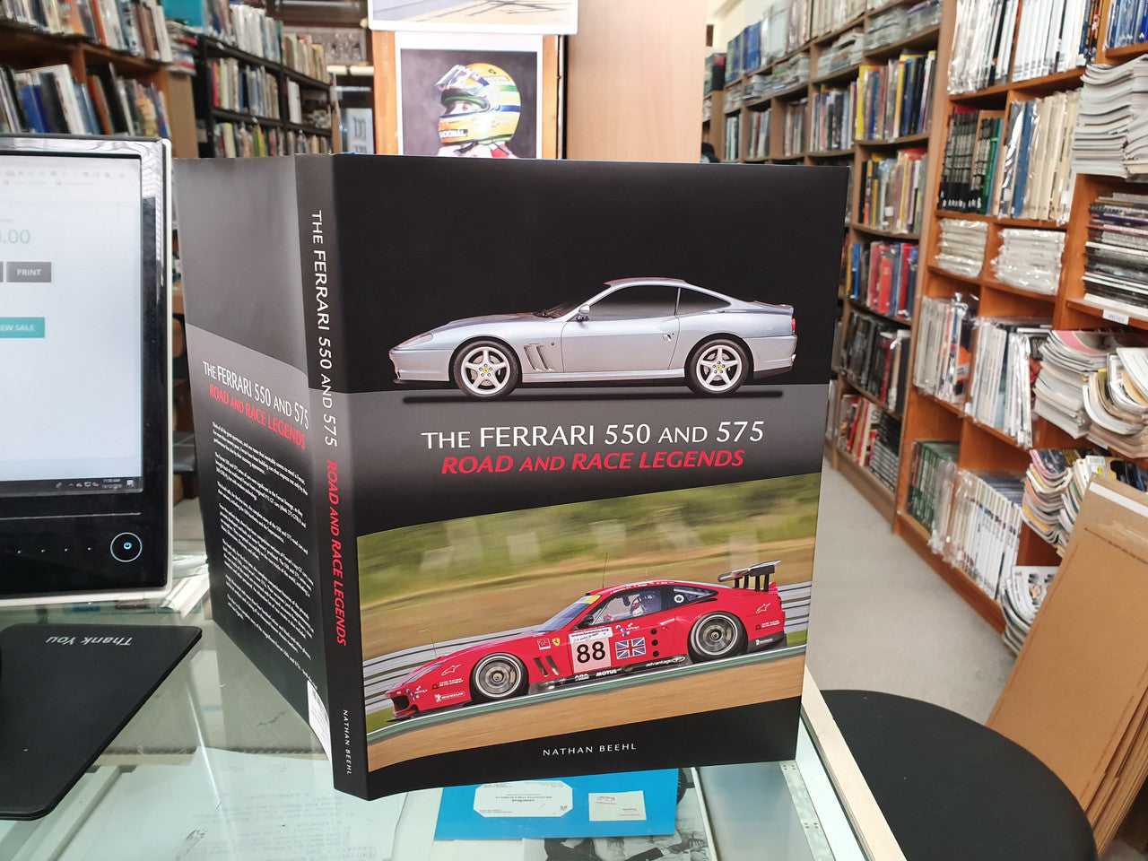 Ferrari 550 and 575 road and race legends hardcover book standing, red race car graphic