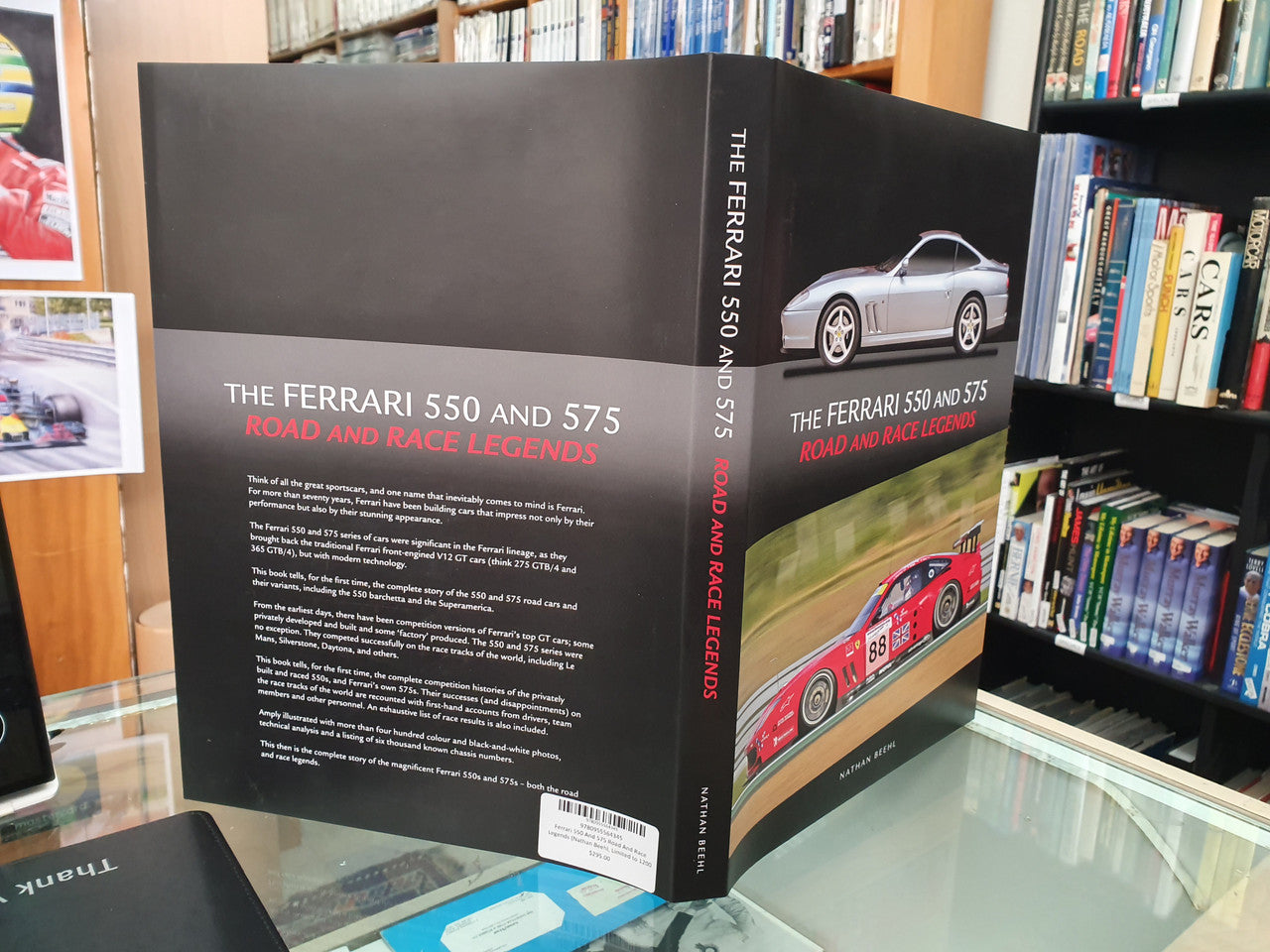 Ferrari 550 and 575 road and race legends hardcover book with car artwork, open