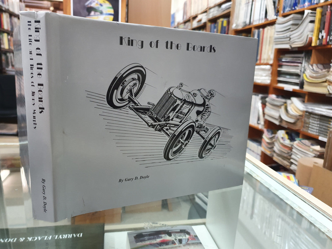 Signed King of the Boards book cover with vintage race car illustration