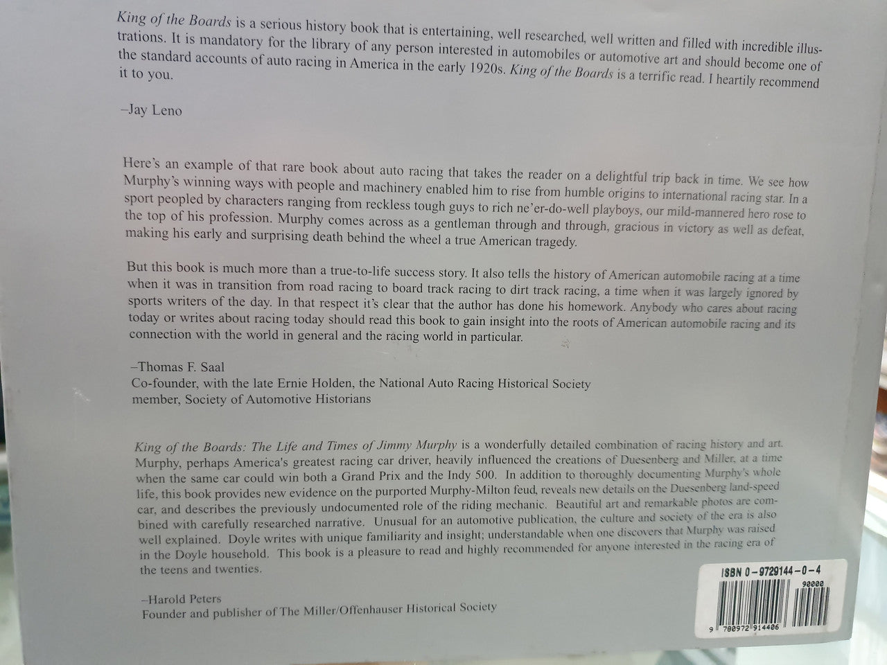 Signed history book back cover with barcode and ISBN on white card