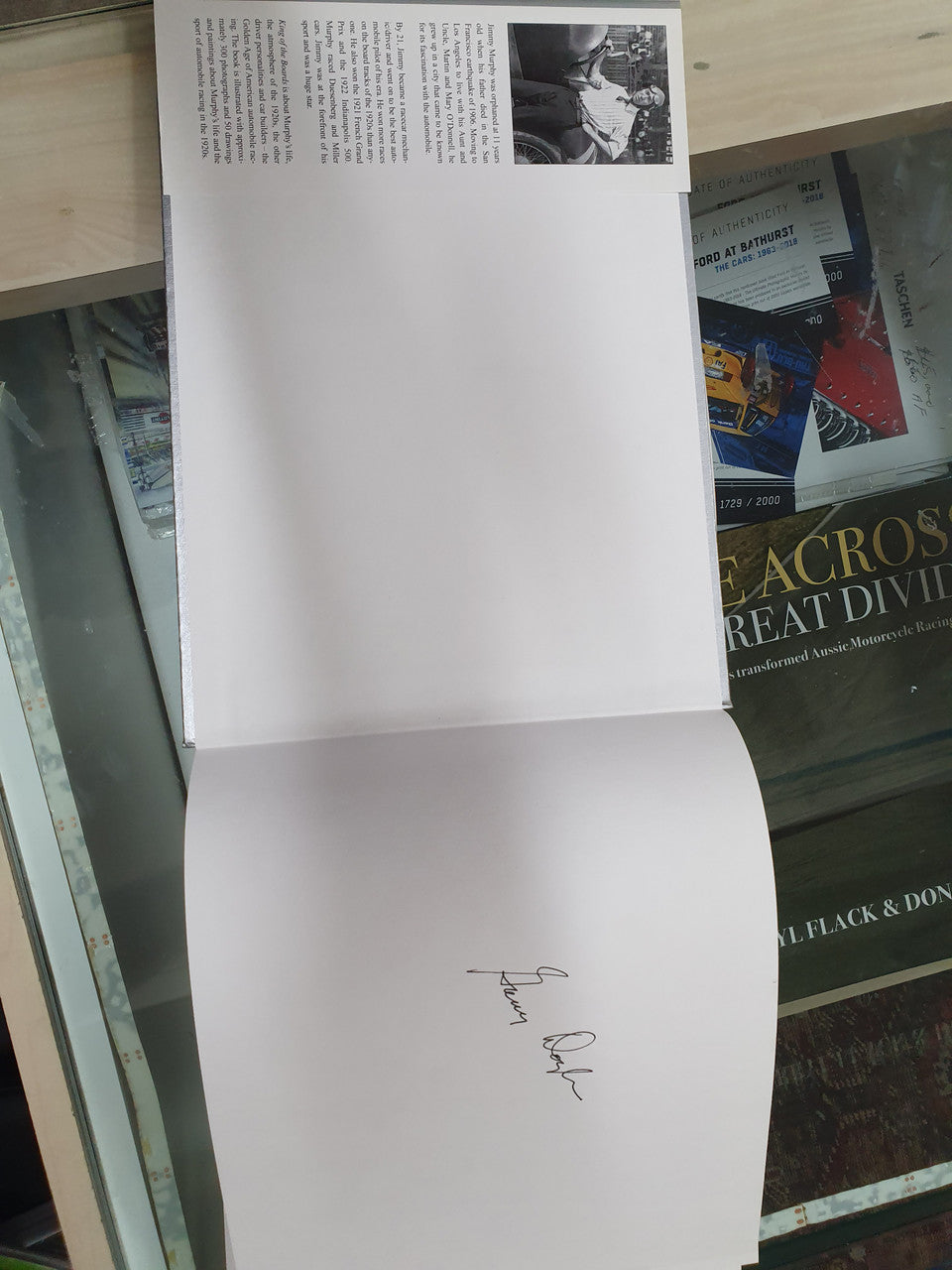 Signed history book open pages with author signature on the white page
