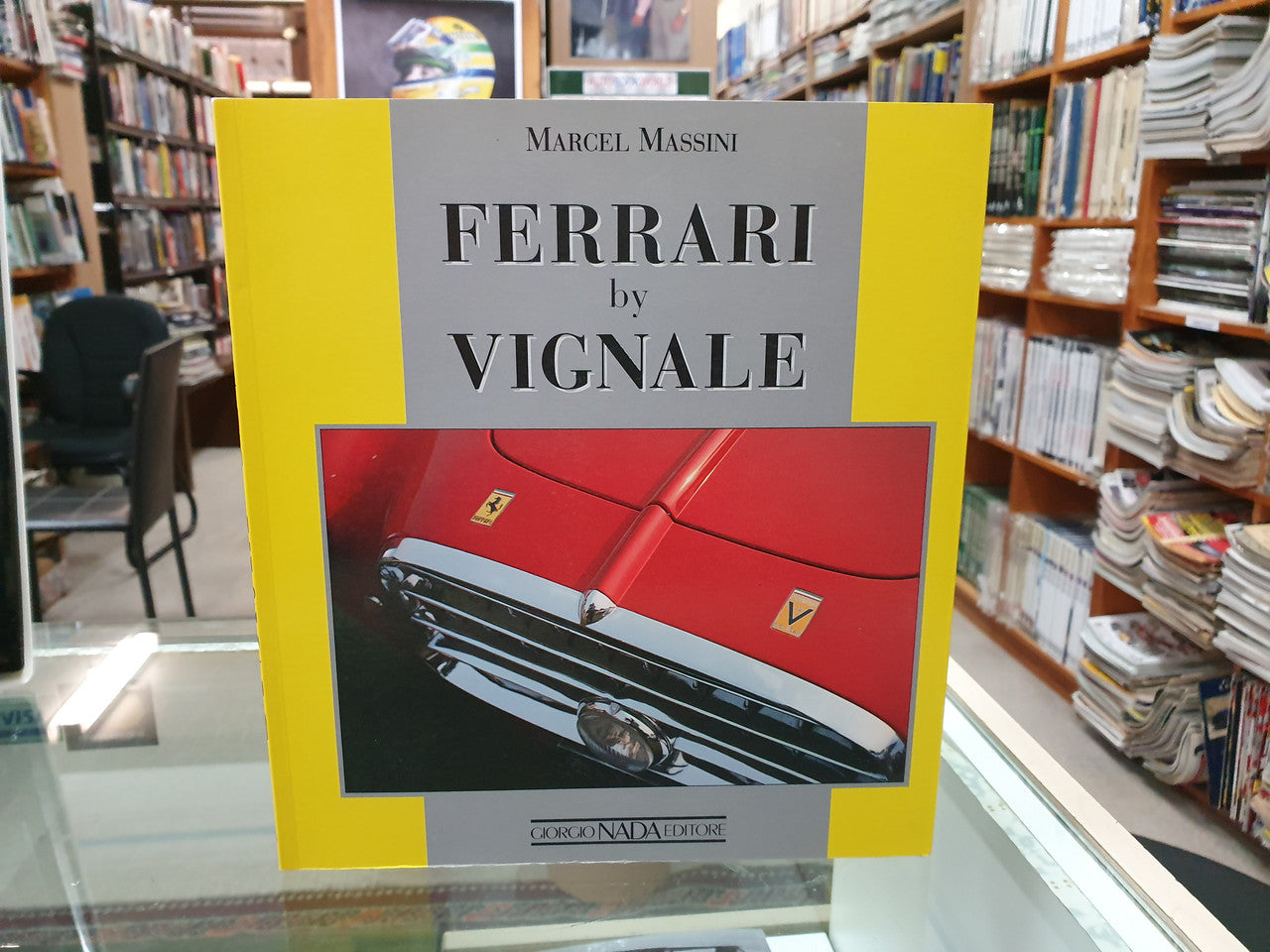 Ferrari by Vignale book with red car cover photo on display shelf
