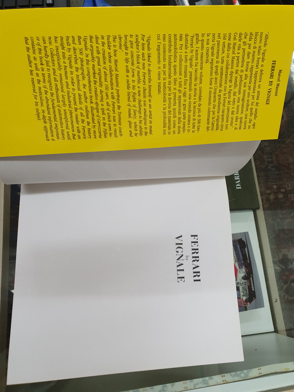 Ferrari by Vignale book open spread with yellow text header and plain page