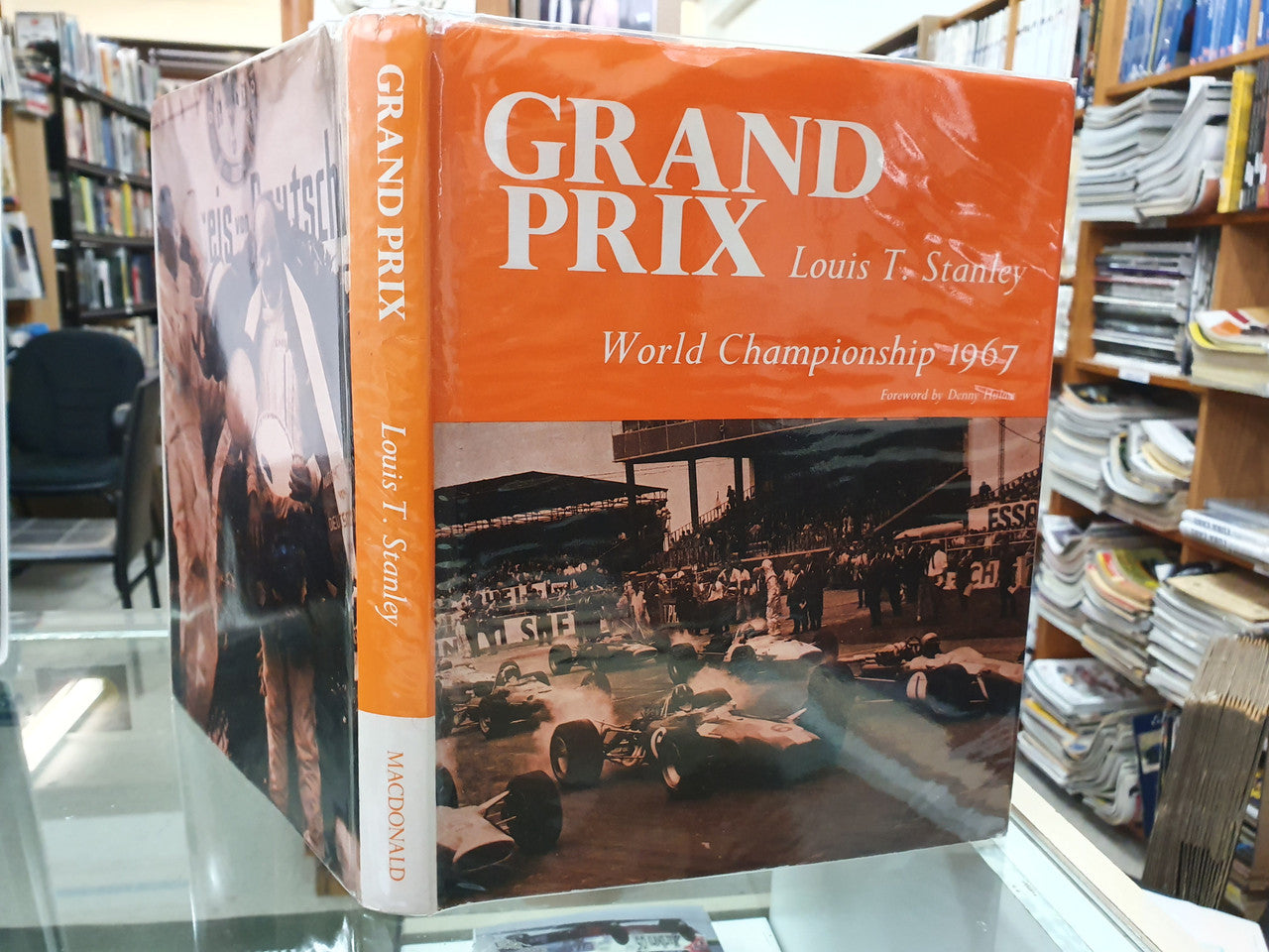 Grand Prix World Championship 1967 book with orange cover and race title