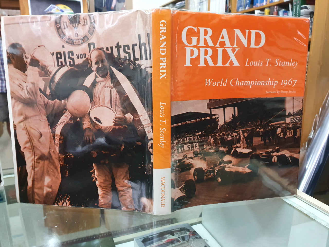 Grand Prix World Championship 1967 book with orange cover and race photo