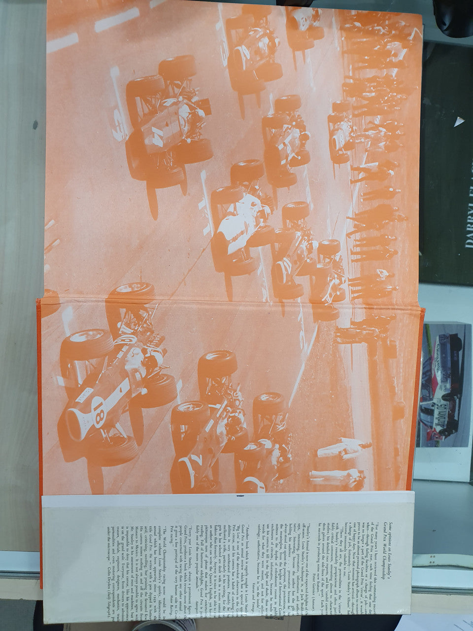Grand Prix World Championship book cover with orange rider silhouettes and caption strip