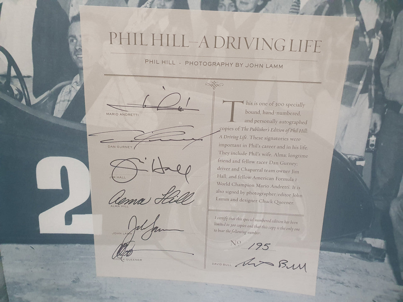 Signed certificate page with multiple autographs and printed text