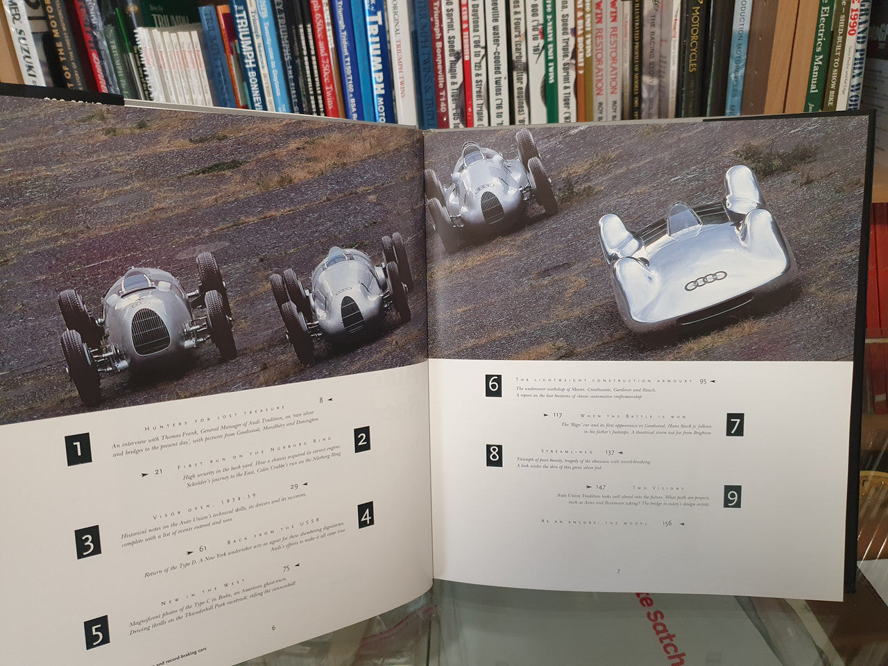 Auto Union GP race car book open spread with vintage car photos and numbered text