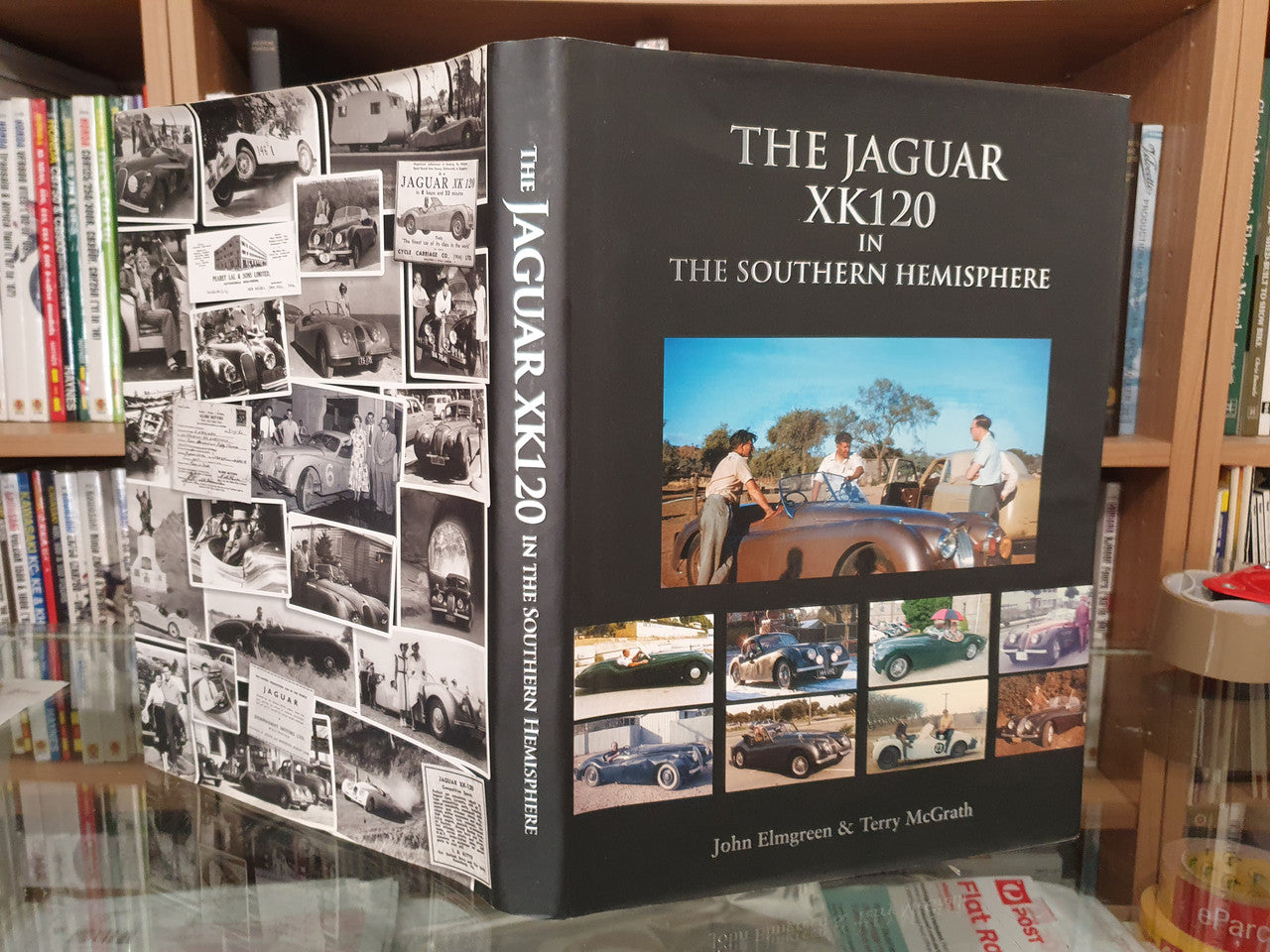 Book cover and photo panels on an open jacket, with Jaguar XK120 title text.