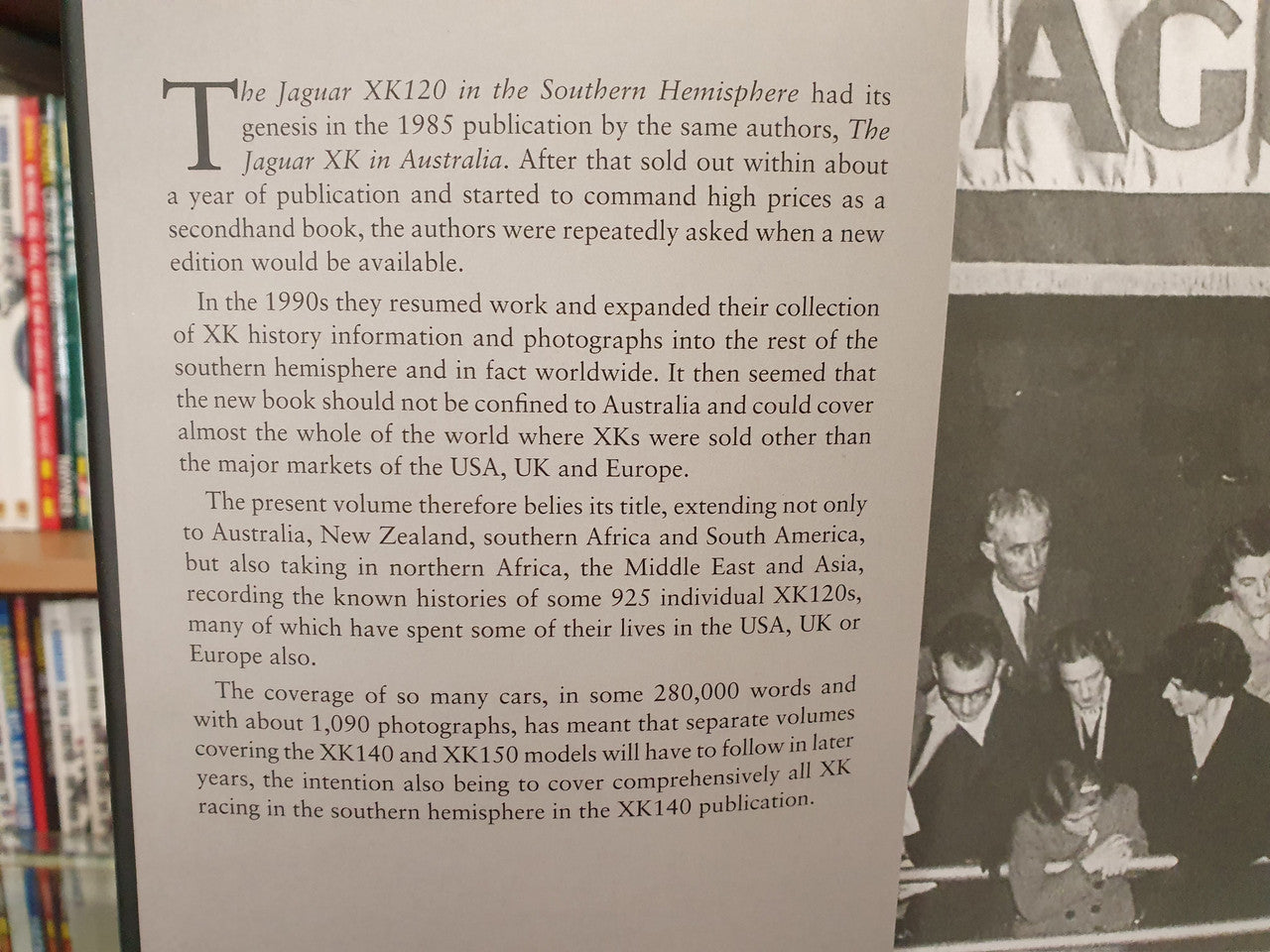 Open book page with paragraphs and black-and-white rally photo near bottom.