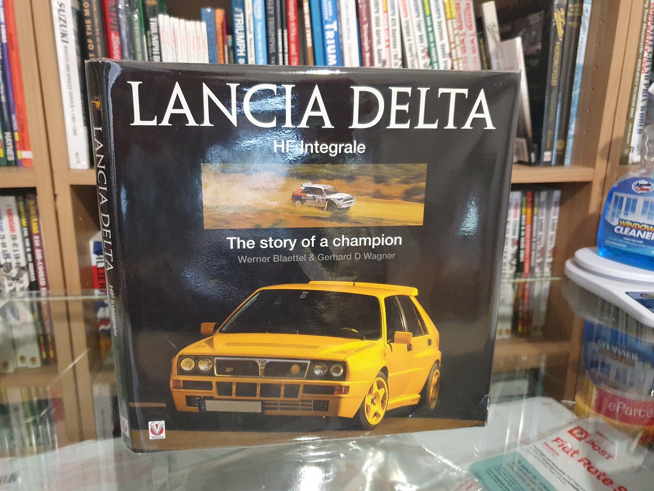 Lancia Delta HF Integrale racing book, front cover with yellow rally car