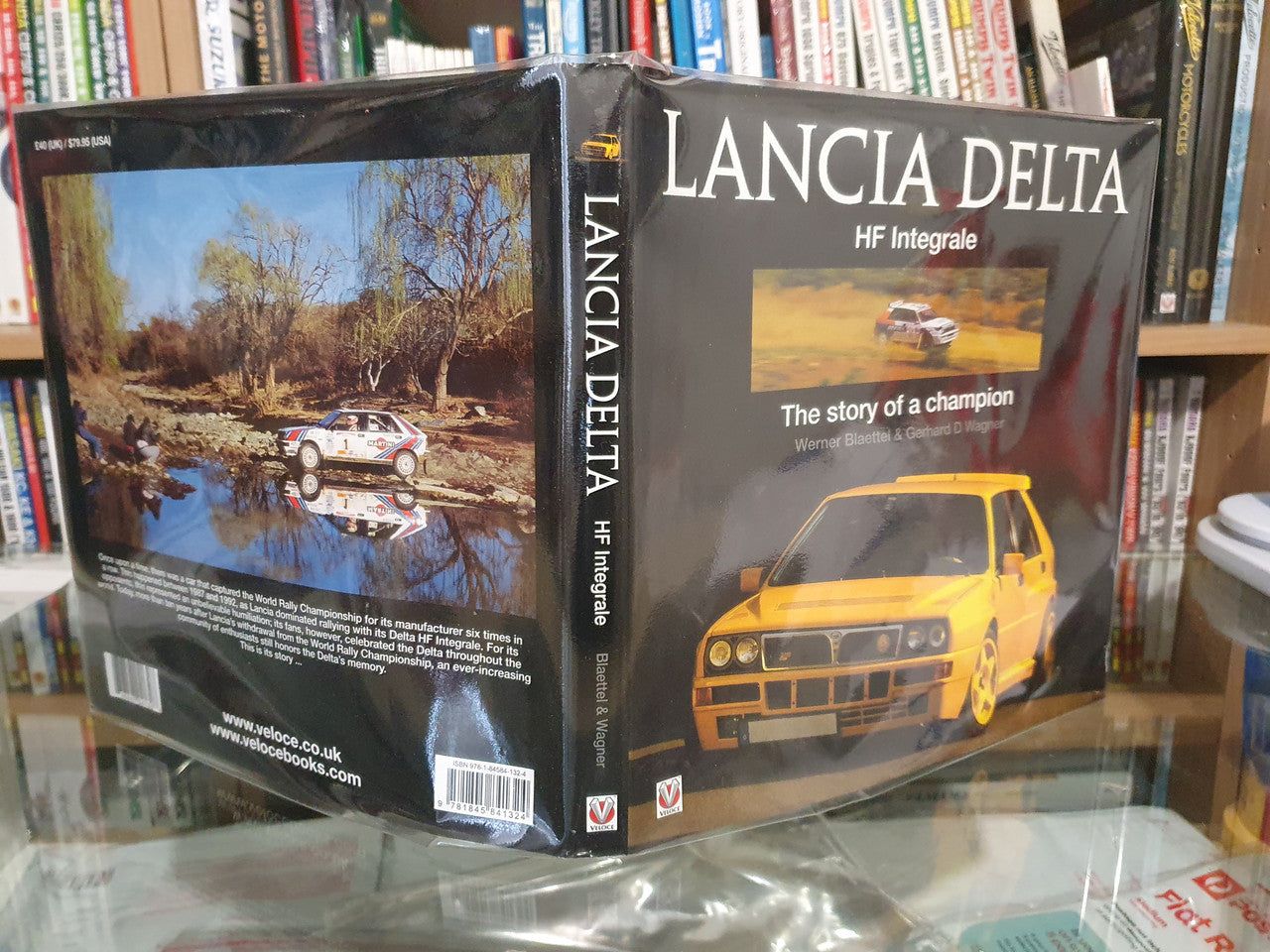 Racing book back cover with yellow car and landscape photo