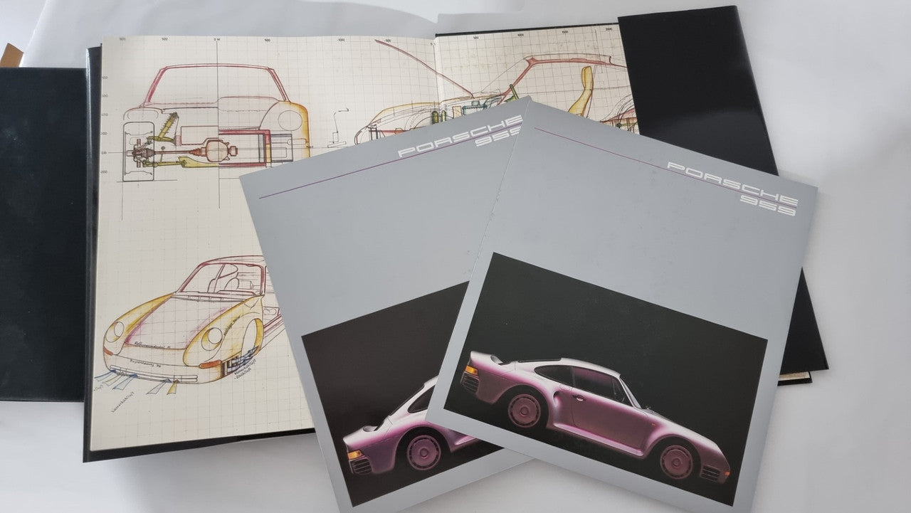 Art book print sheets with vehicle design sketches and pink car render