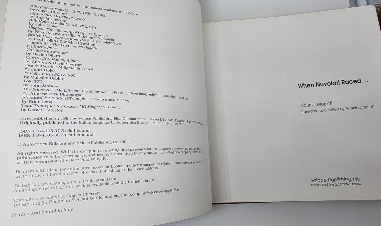 Open leather-bound book with printed text on both pages