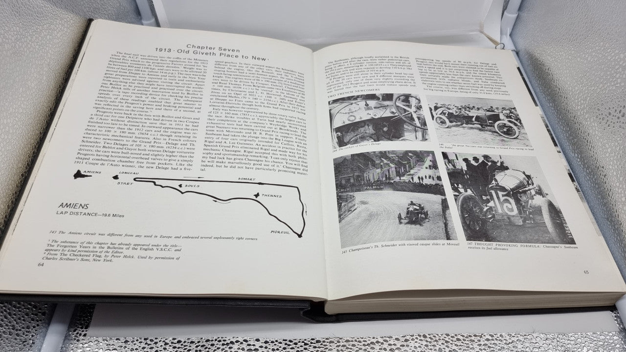 Grand Prix motor racing history book open to pages with photos and diagrams