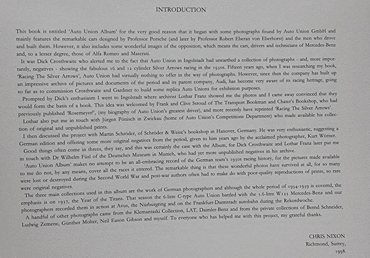 Album introduction page with dense black text and signature at bottom