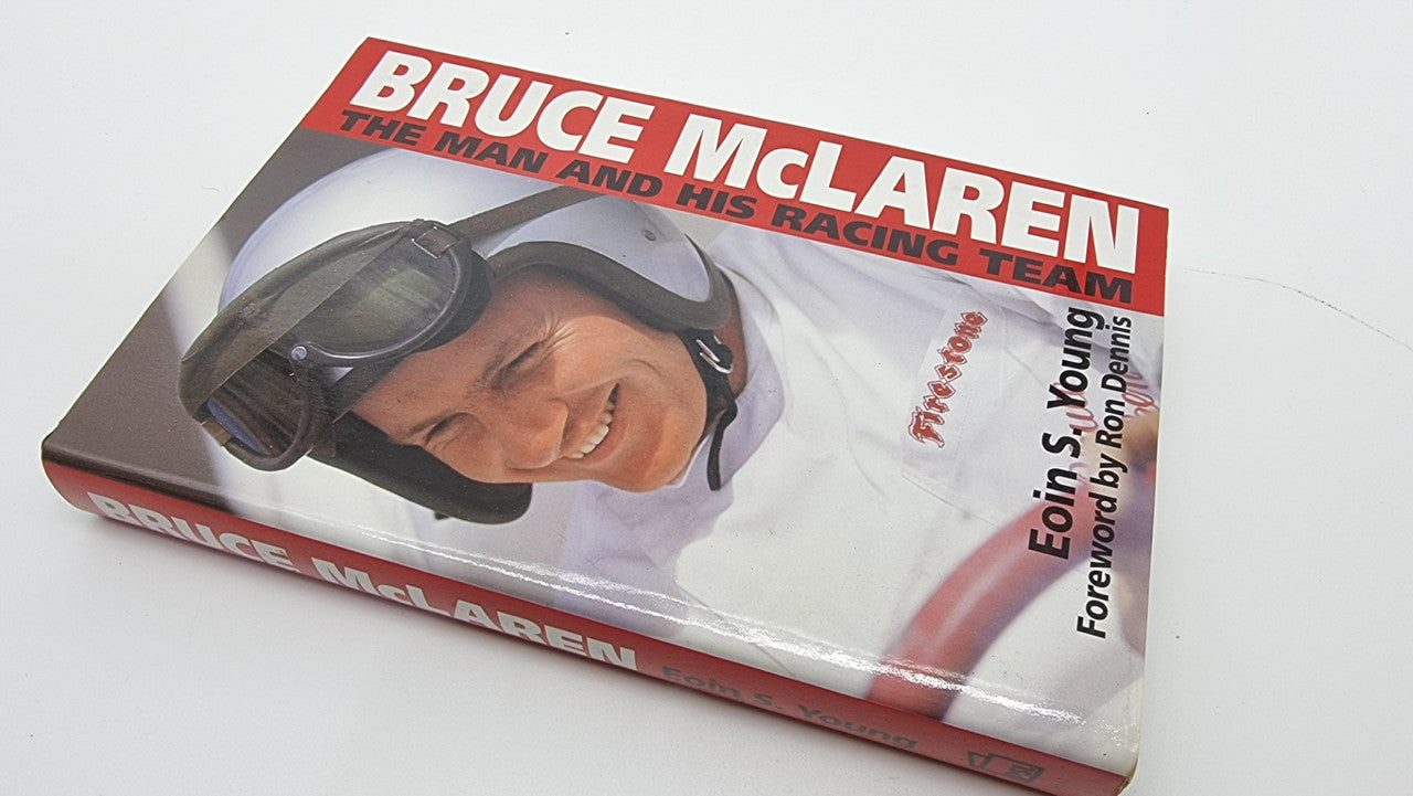 Hardcover book showing helmet portrait cover with Foreword by Ron Dennis text