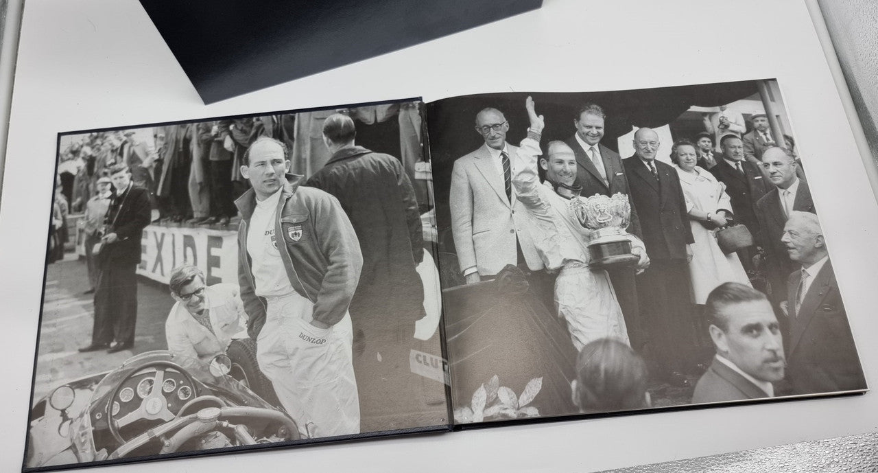 Signed 1961 scrapbook open to black-and-white photo spread