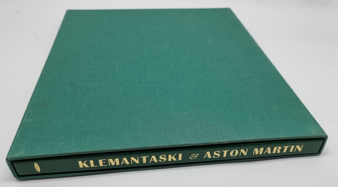 Green slipcased leatherbound book with gold spine lettering reading Klemantaski & Aston Martin.