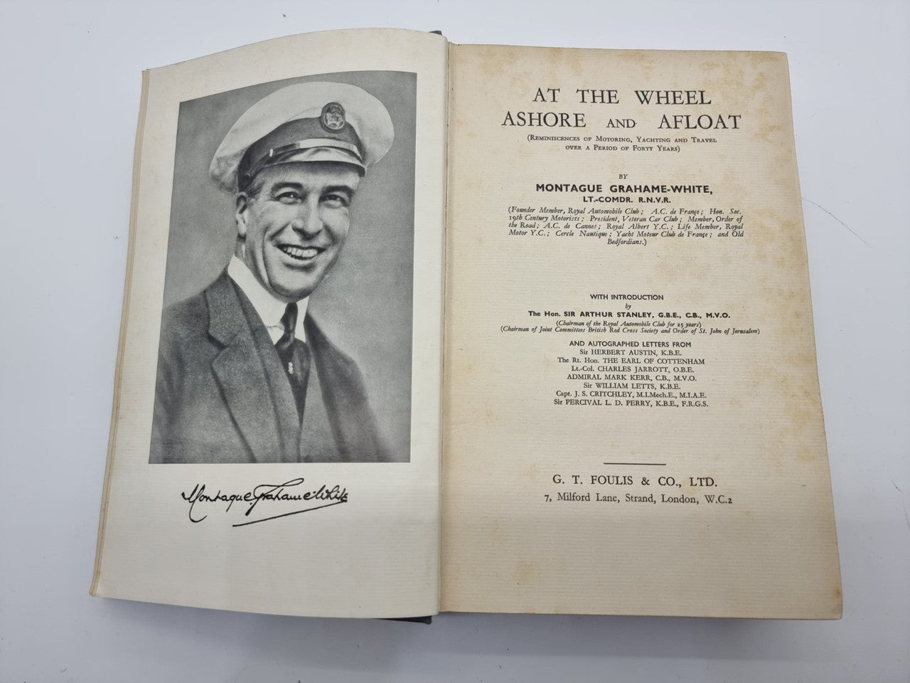 Open book with portrait photo on left page and title page on right