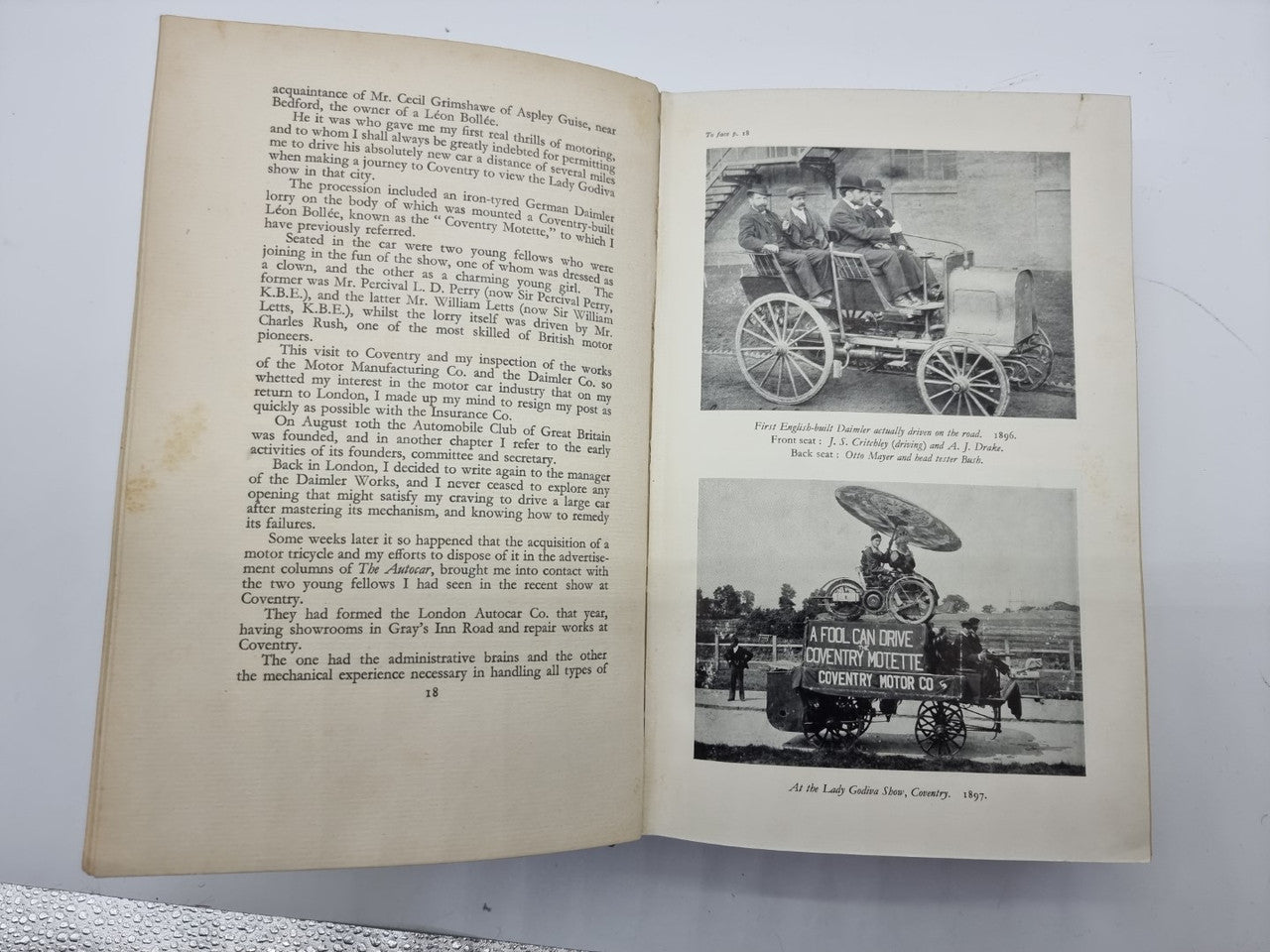 Open book with two vehicle photos on right and typed paragraphs on left