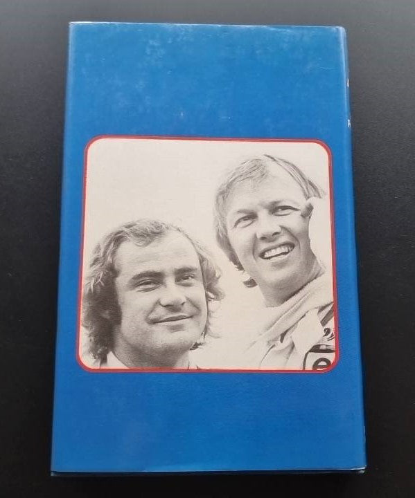 Blue book cover featuring two smiling portrait photos inside a rounded red frame