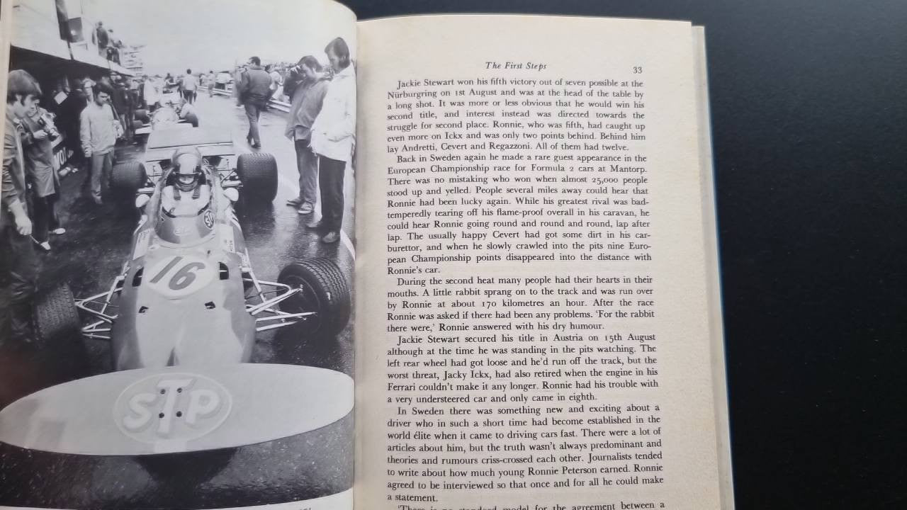 Book open to a spread with a large black-and-white team photo and body text