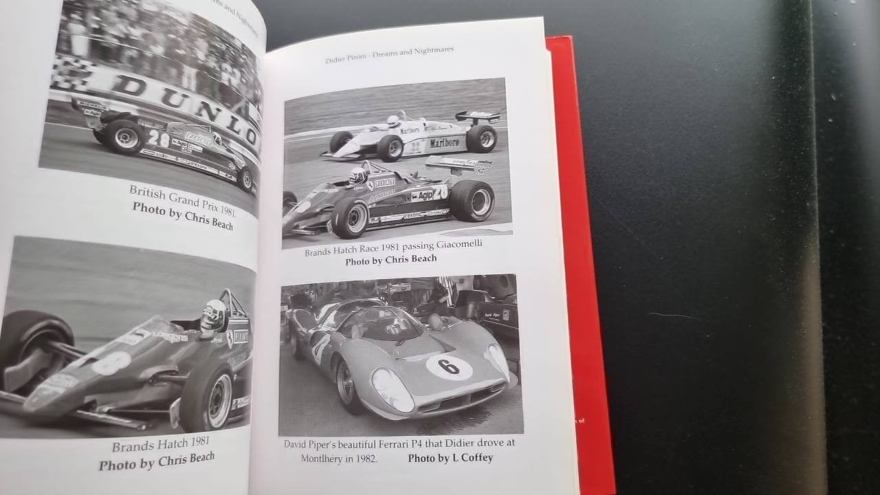 Opened book with black-and-white racing photos and caption text.