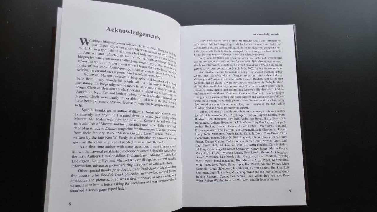 Open book spread showing Acknowledgements heading and dense body text