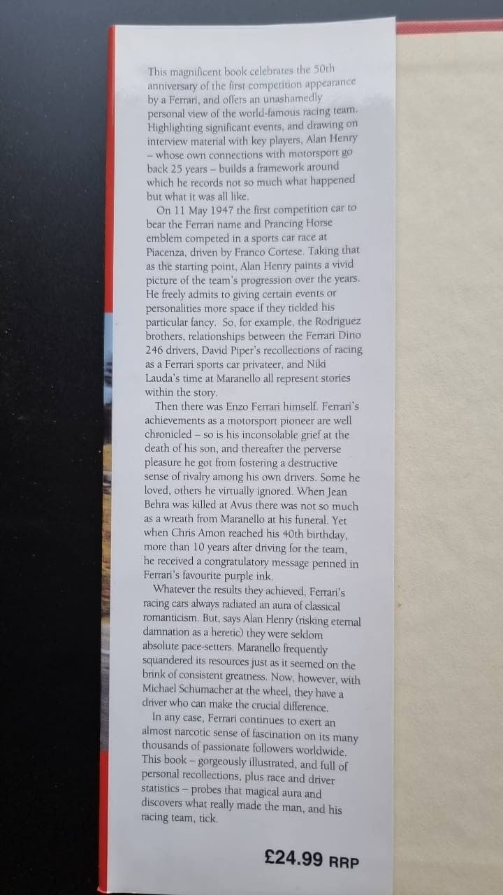Ferrari racing history book spine with stacked printed text.